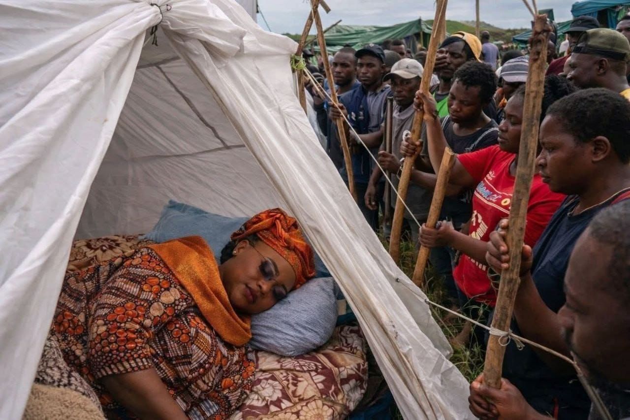 Gueta Antoinette trips on her capulana