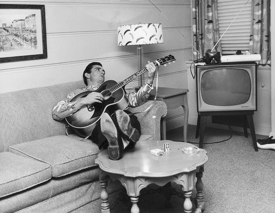 Johnny Cash in Nashville — Michael Ochs Archives. Available light, a domestic room, nobody supervising.