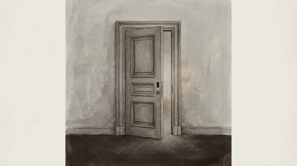 Ornate wooden door standing slightly ajar, with an empty mortise where a lock should be installed. No deadbolt, no latch, no hardware — just a cavity where the lock was never installed.