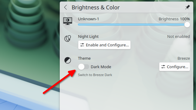 The Dark Mode toggle in the system tray in Plasma .7
