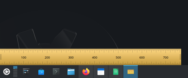 The KRuler tool being used to measure the width of a KDE Plasma task bar.