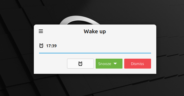 The Linux Mint alarm notification dialog, with buttons to snooze, dismiss, or open the alarm settings app.
