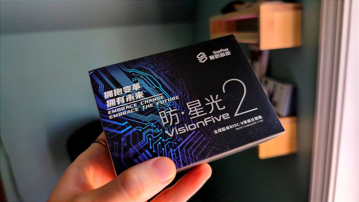 A StarFive VisionFive 2 box being held in a person's hand.