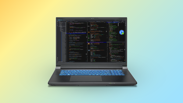 The Kubuntu Focus Zr Gen 2 laptop with a development environment on-screen, on top of a yellow-to-blue gradient background.