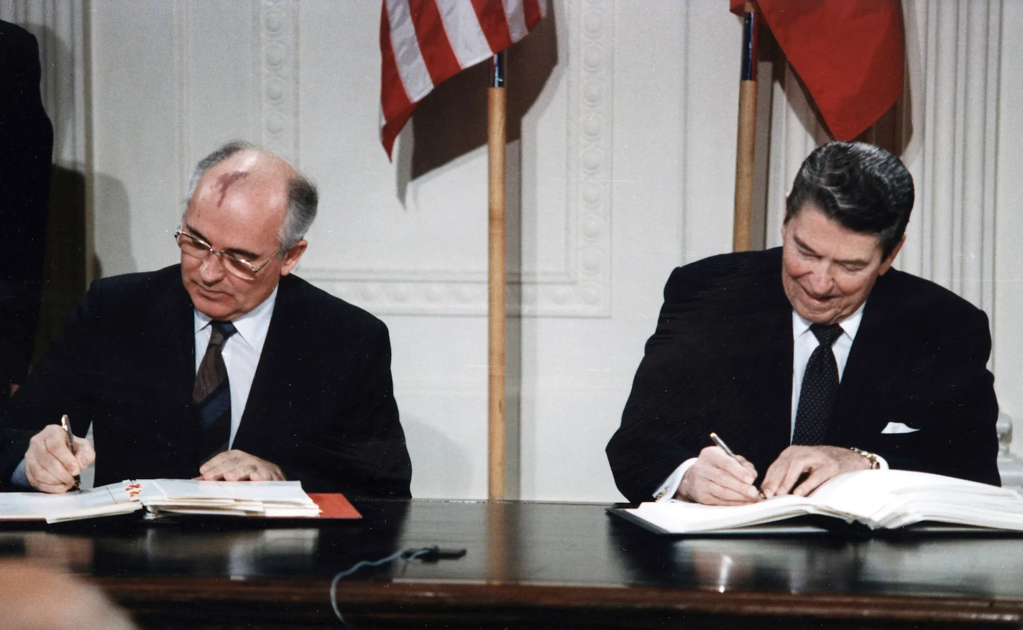 Mikhail Gorbachev and Ronald Reagan signing the Intermediate-Range Nuclear Forces Treaty (INF) at the White House in 1987.