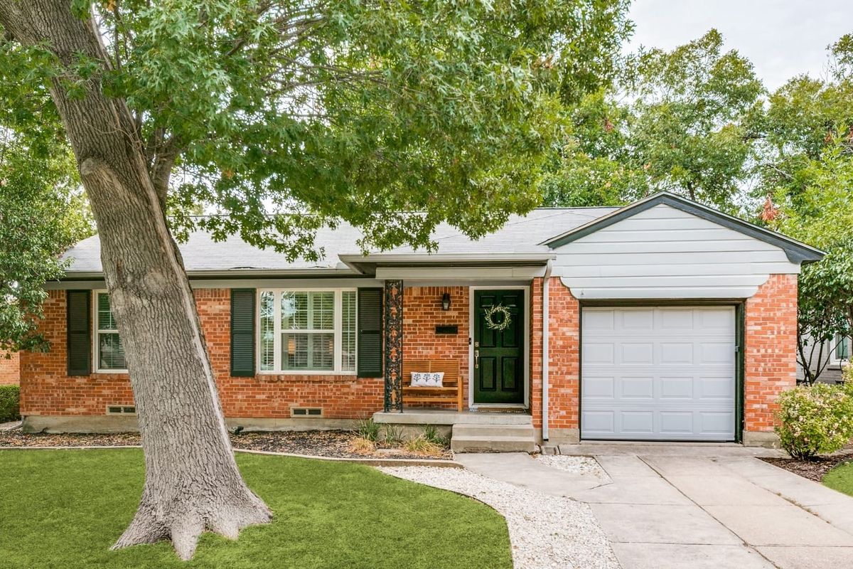 Exterior of 6126 Saint Moritz, a home in the Caruth Terrace neighborhood of Dallas, Texas, known for its tree-lined streets and midcentury architecture.