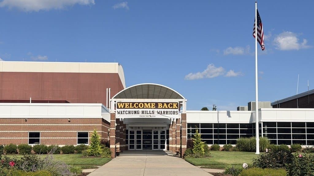 Welcome Back Watchung Hills Warriors banner over the front entrance of Watchung Hills Regional High School on opening day