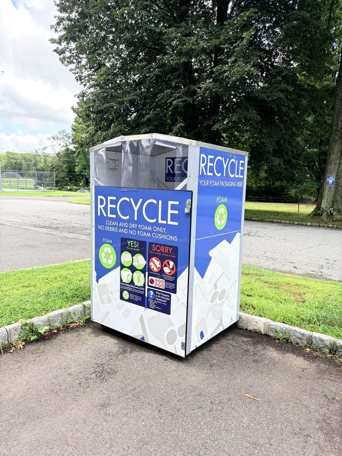 The blue and white foam recycling container at the corner of Bardy Road and Elks Trail in Warren Township, labelled Recycle your foam packaging here, clean and dry foam only.
