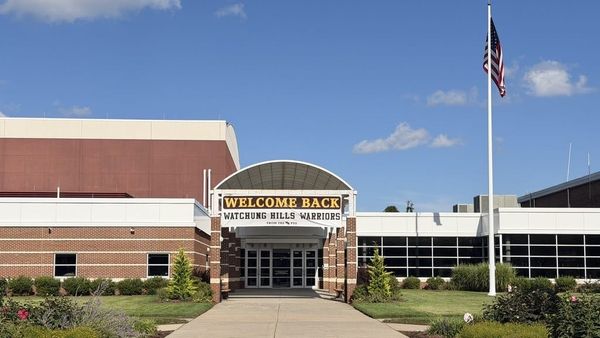 Welcome Back Watchung Hills Warriors banner over the front entrance of Watchung Hills Regional High School on opening day