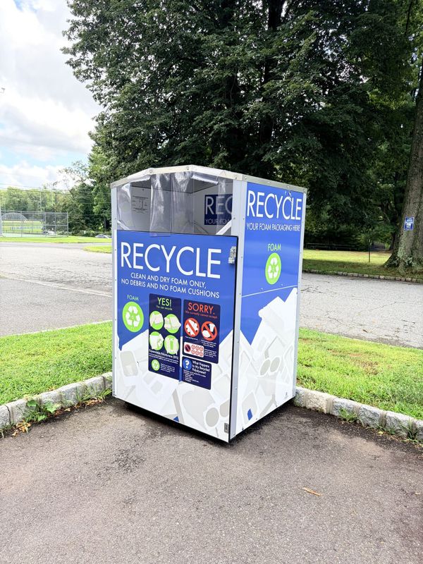 The blue and white foam recycling container at the corner of Bardy Road and Elks Trail in Warren Township, labelled Recycle your foam packaging here, clean and dry foam only.