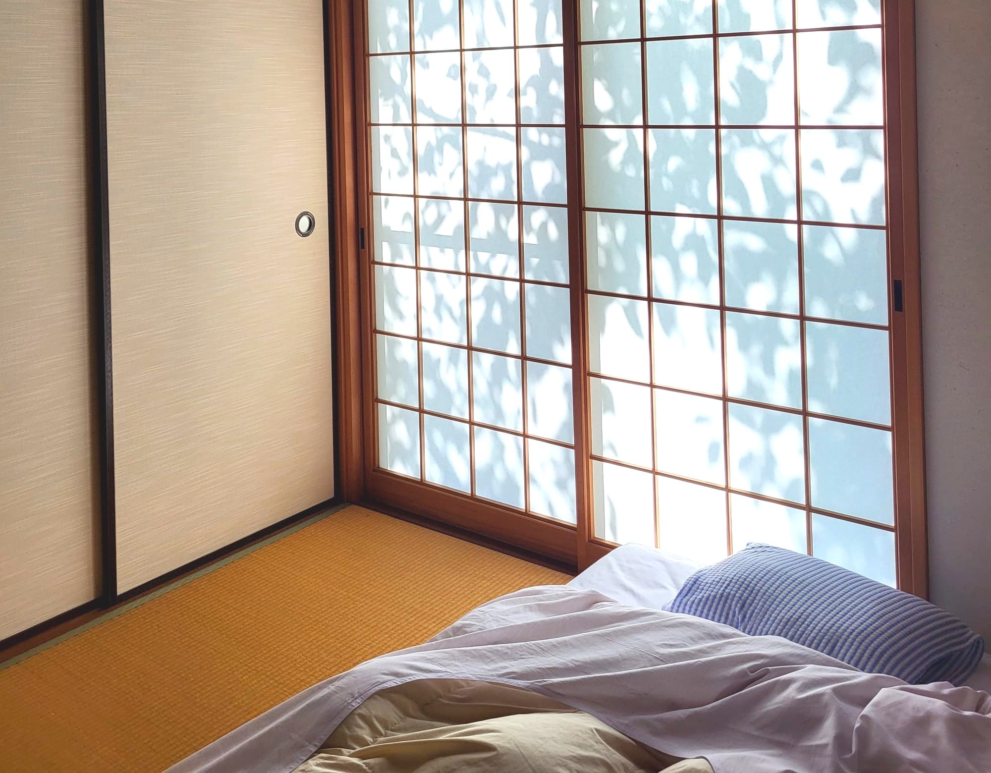 a traditional Japanese room with a futon in the morning in Tokyo, Japan
