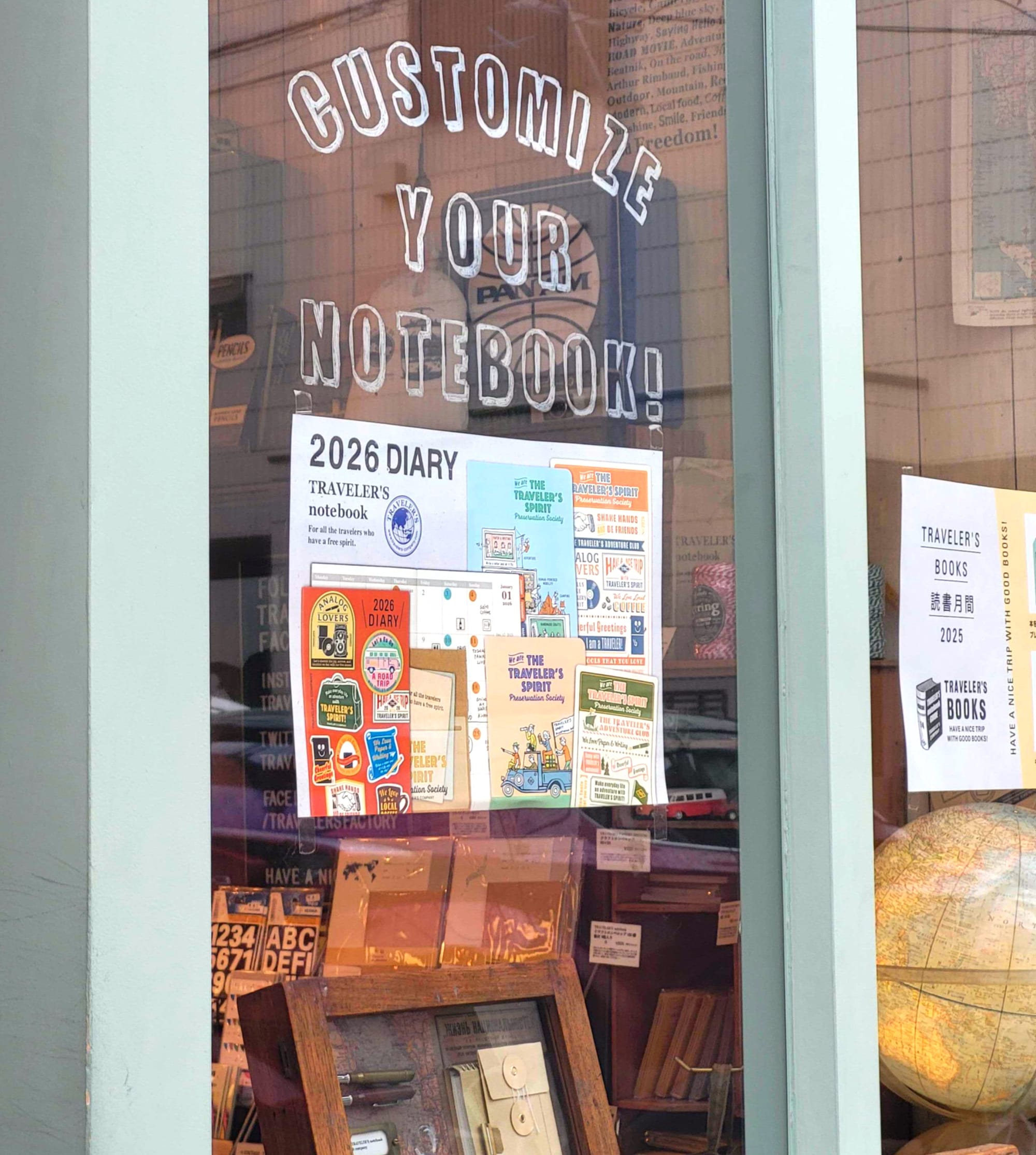 The entrance of a vintage style stationery shop in Tokyo, showing a sign that says that you can customize your notebook