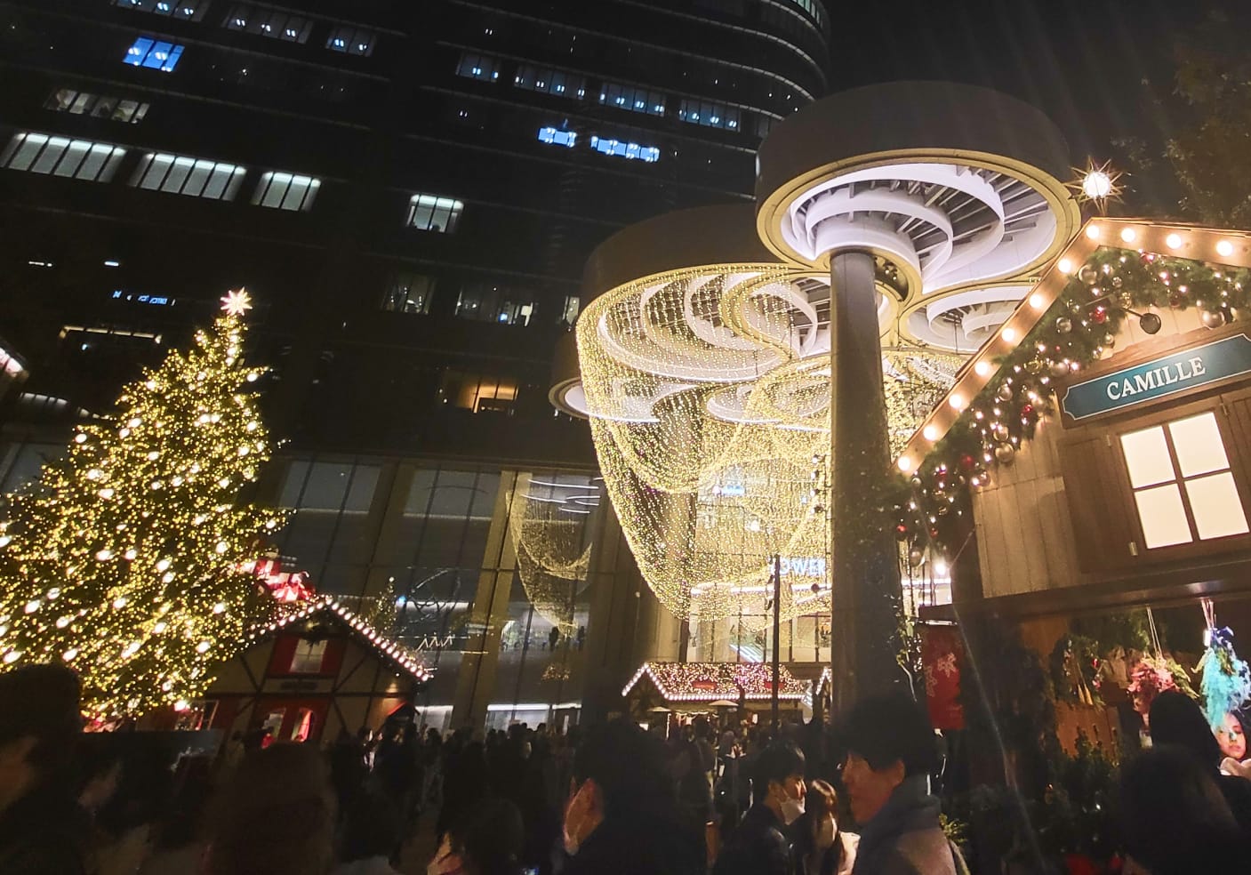 Azabudai Hills Christmas Market decorated with glowing lights and a festive Christmas tree.