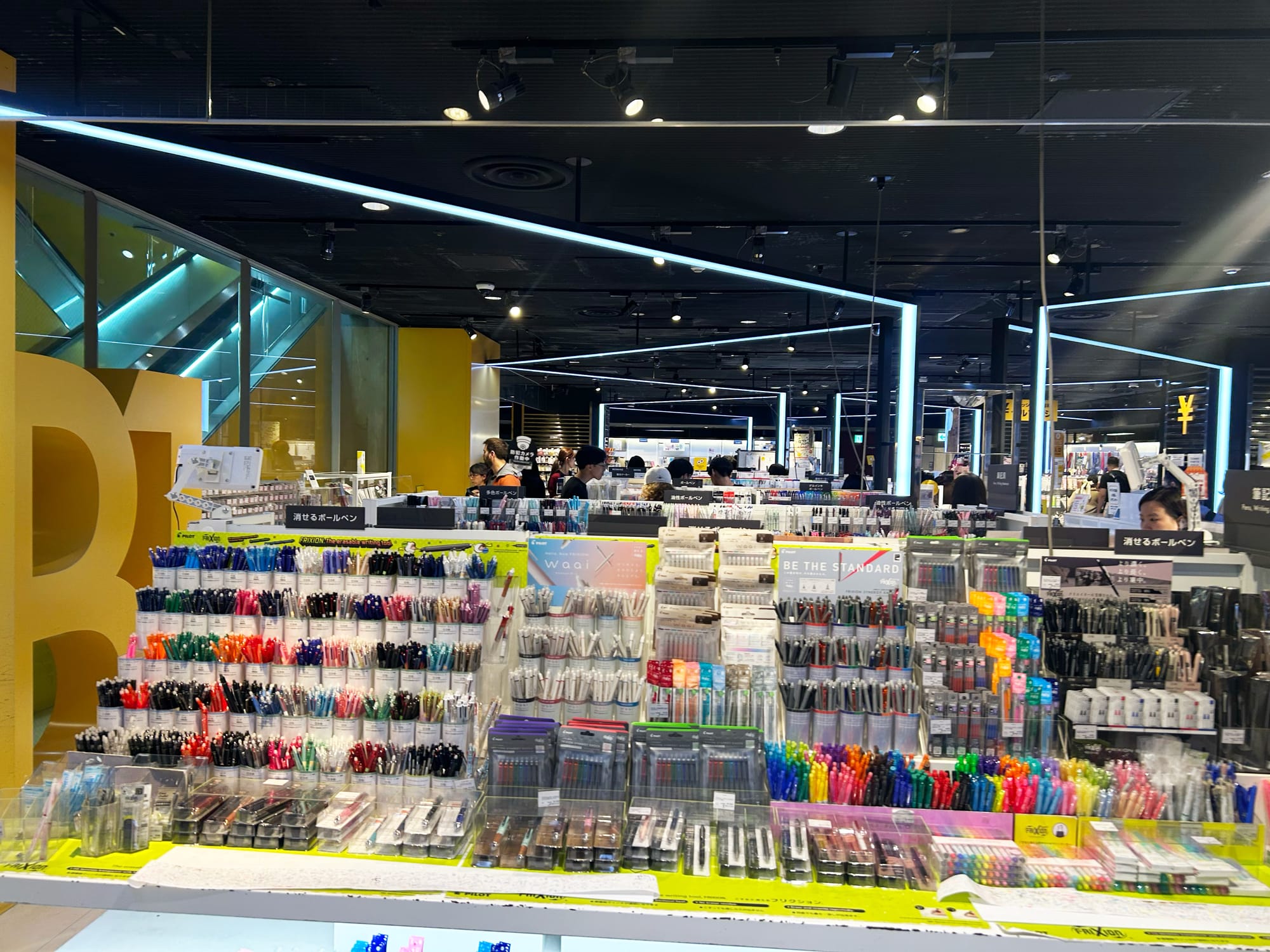 The inside of a huge stationery shop in Loft, Tokyo, with shelves full of colorful pens and pencils