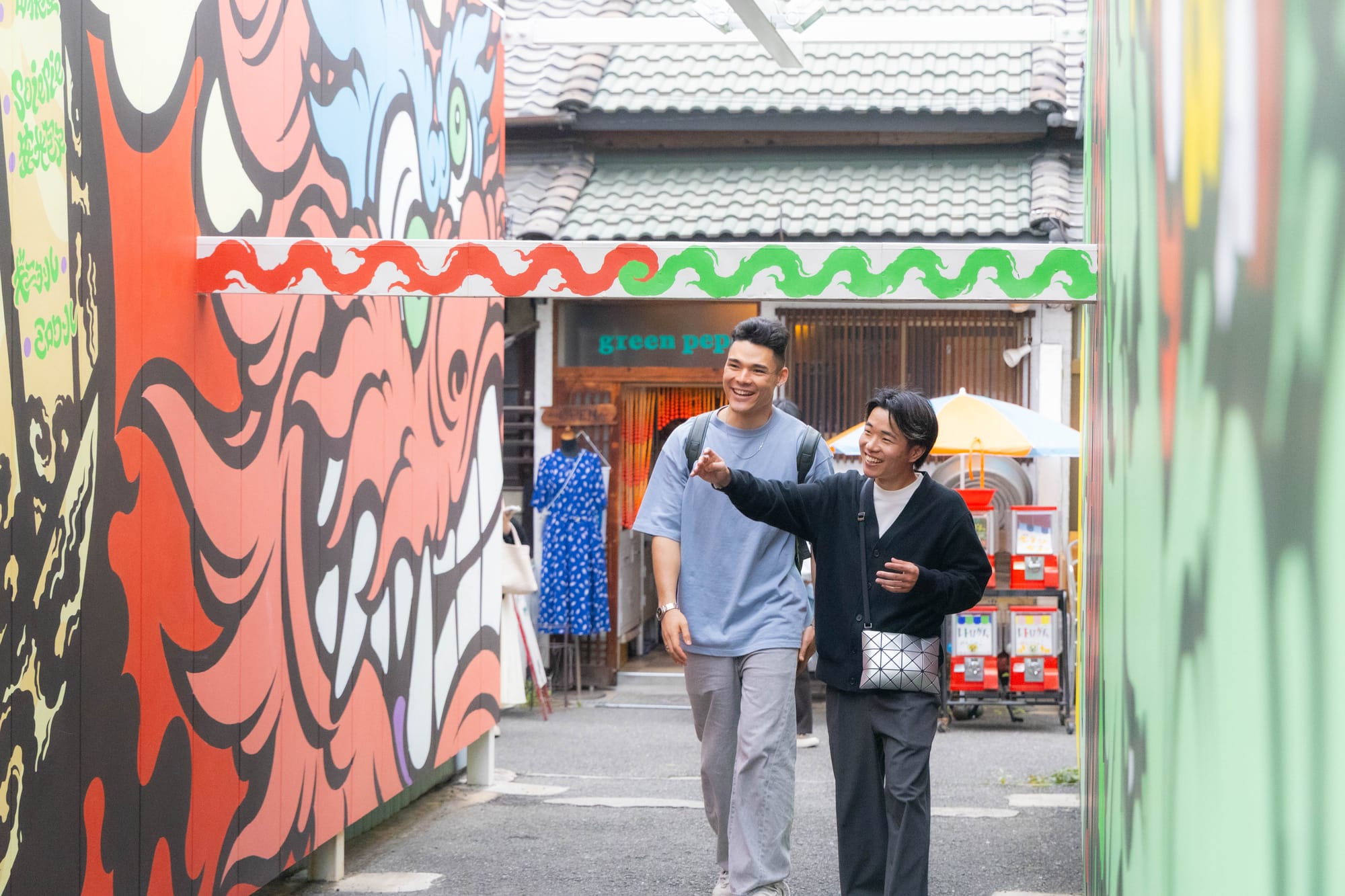 a tourist and a tour leader walking around in Japan and smiling