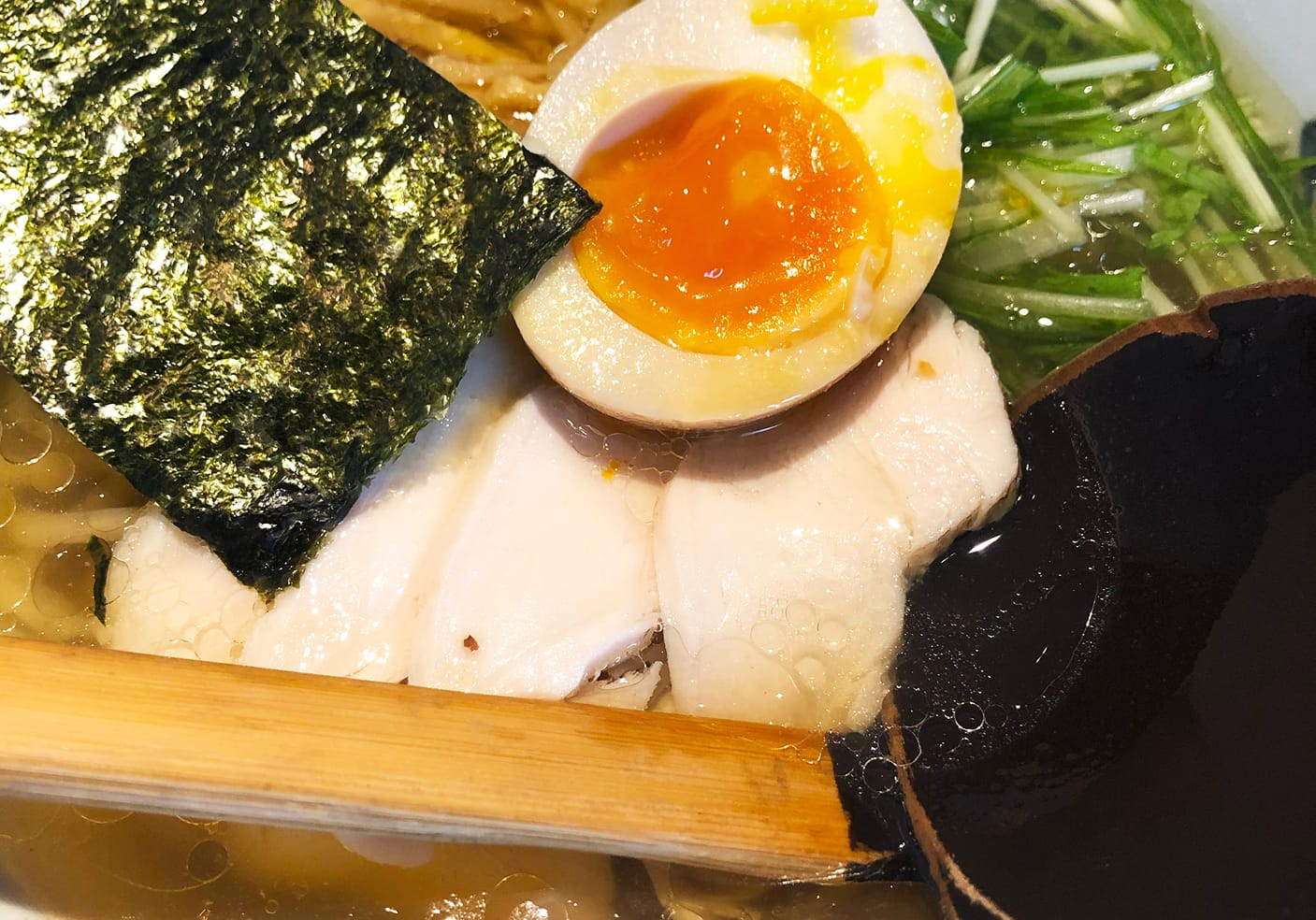 The signature Yuzu ramen in Afuri. Bowl of ramen with meat, seaweed, and egg.