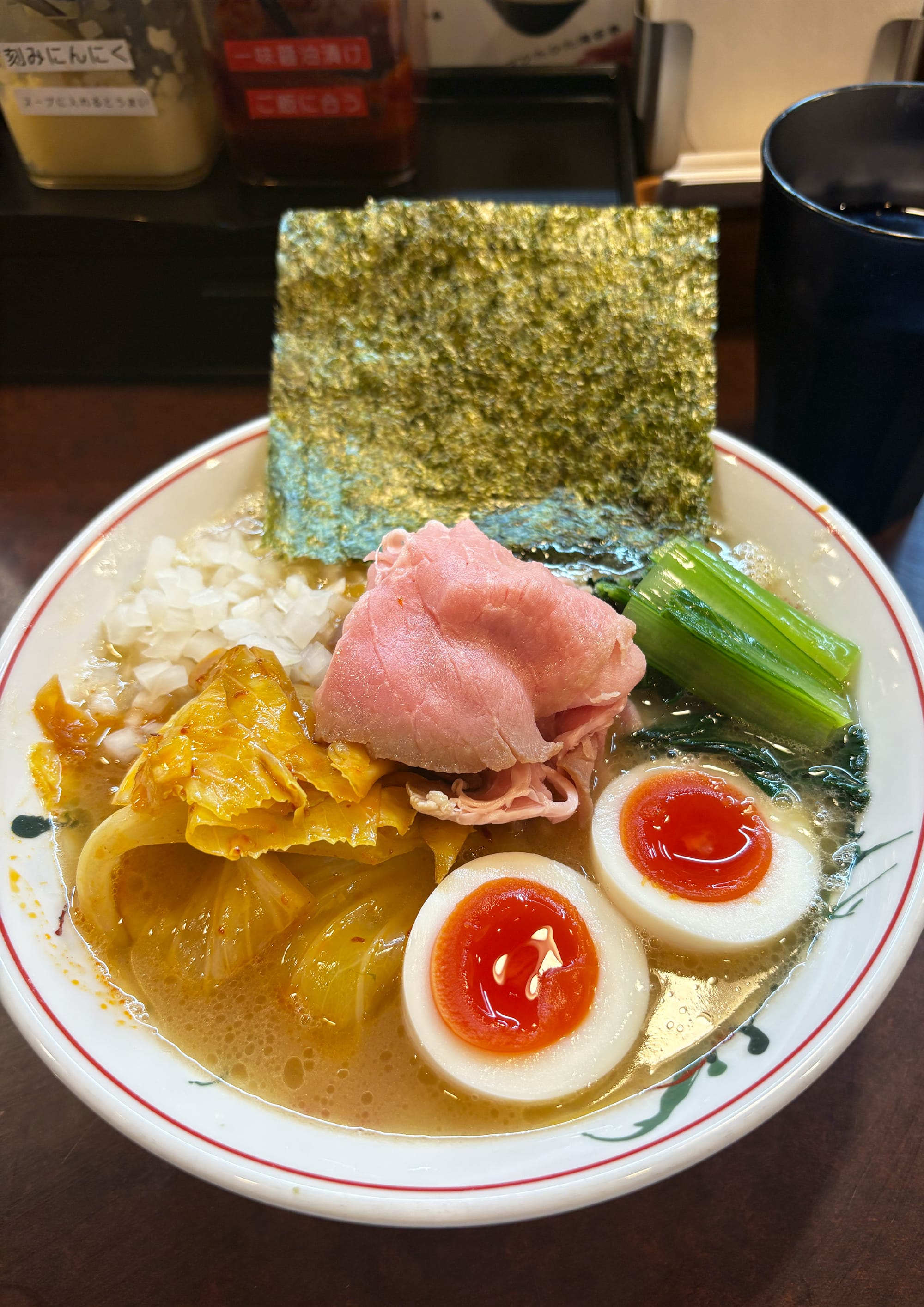 The Tonkotsu Shōyū Ramen at Koike no Iekei in Tokyo. Bowl of ramen with meat, seaweed, and egg.