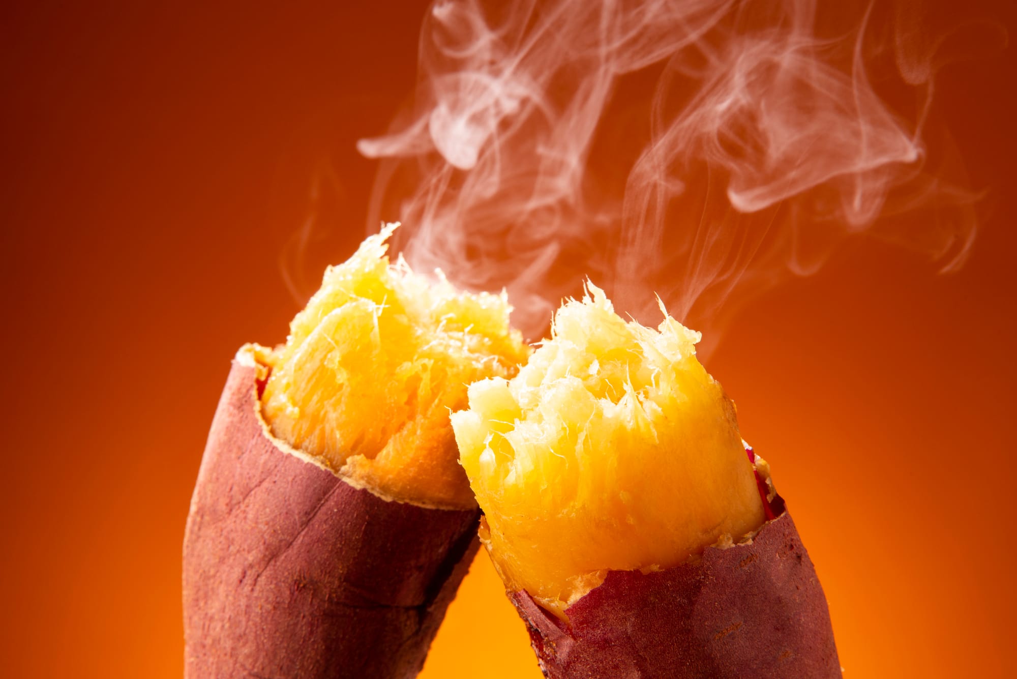 Steaming roasted sweet potato (yakiimo) split open, golden flesh exposed