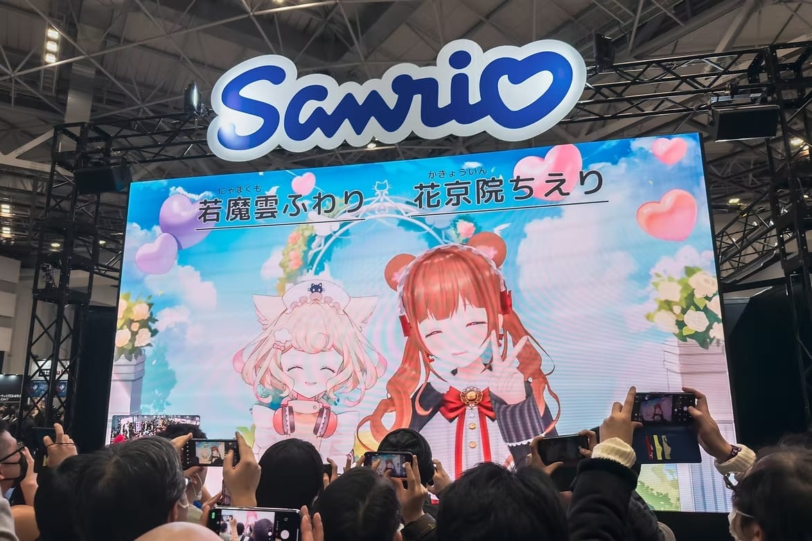 VTubers (virtual YouTubers) greeting the audience at the Sanrio booth at Comiket