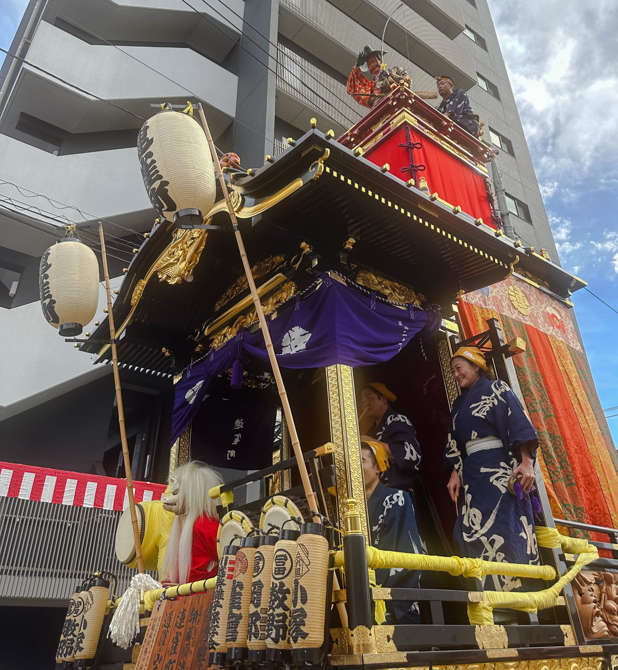 People on the Sky float dressed in traditional festival attire during the Kawagoe festival.