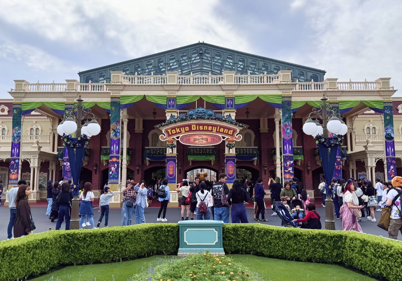 The entrance to Tokyo Disneyland decorated for Halloween 2025