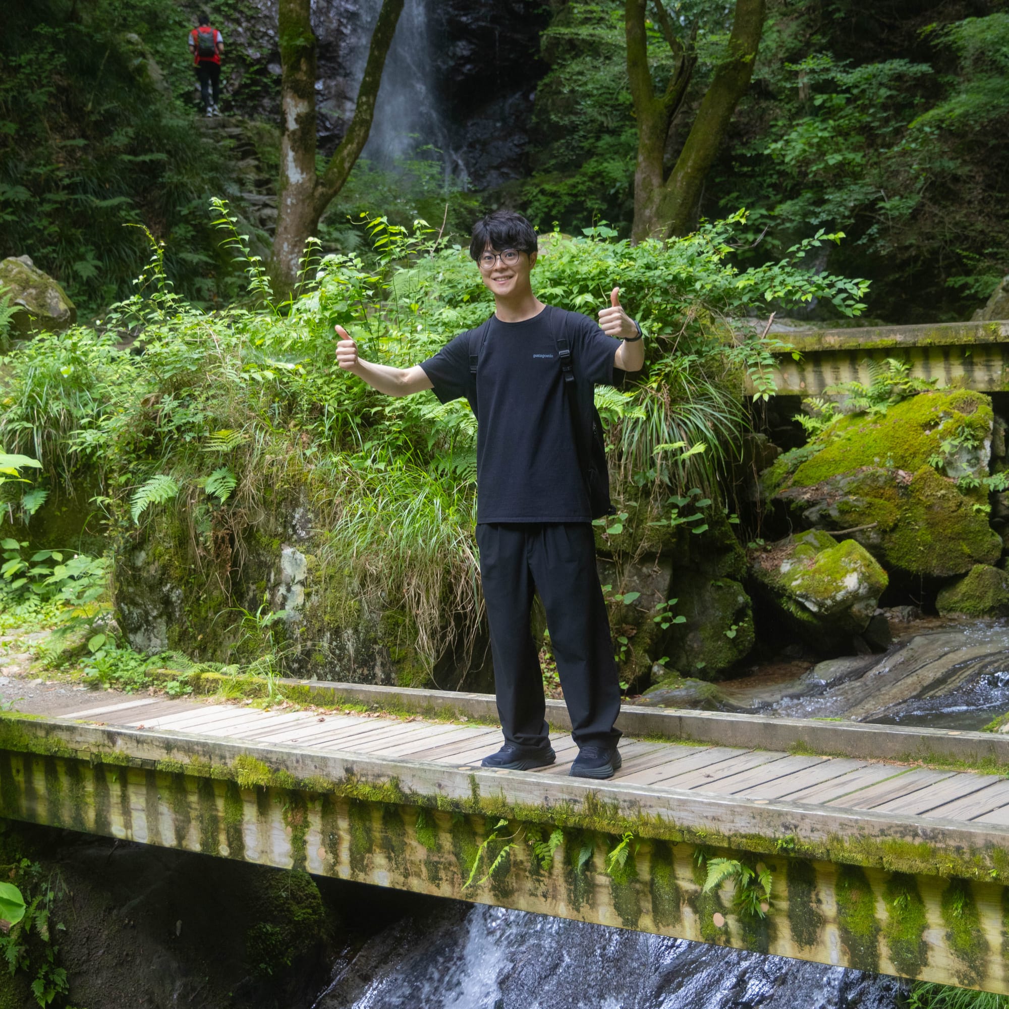 Man standing on a scenic countryside hidden path