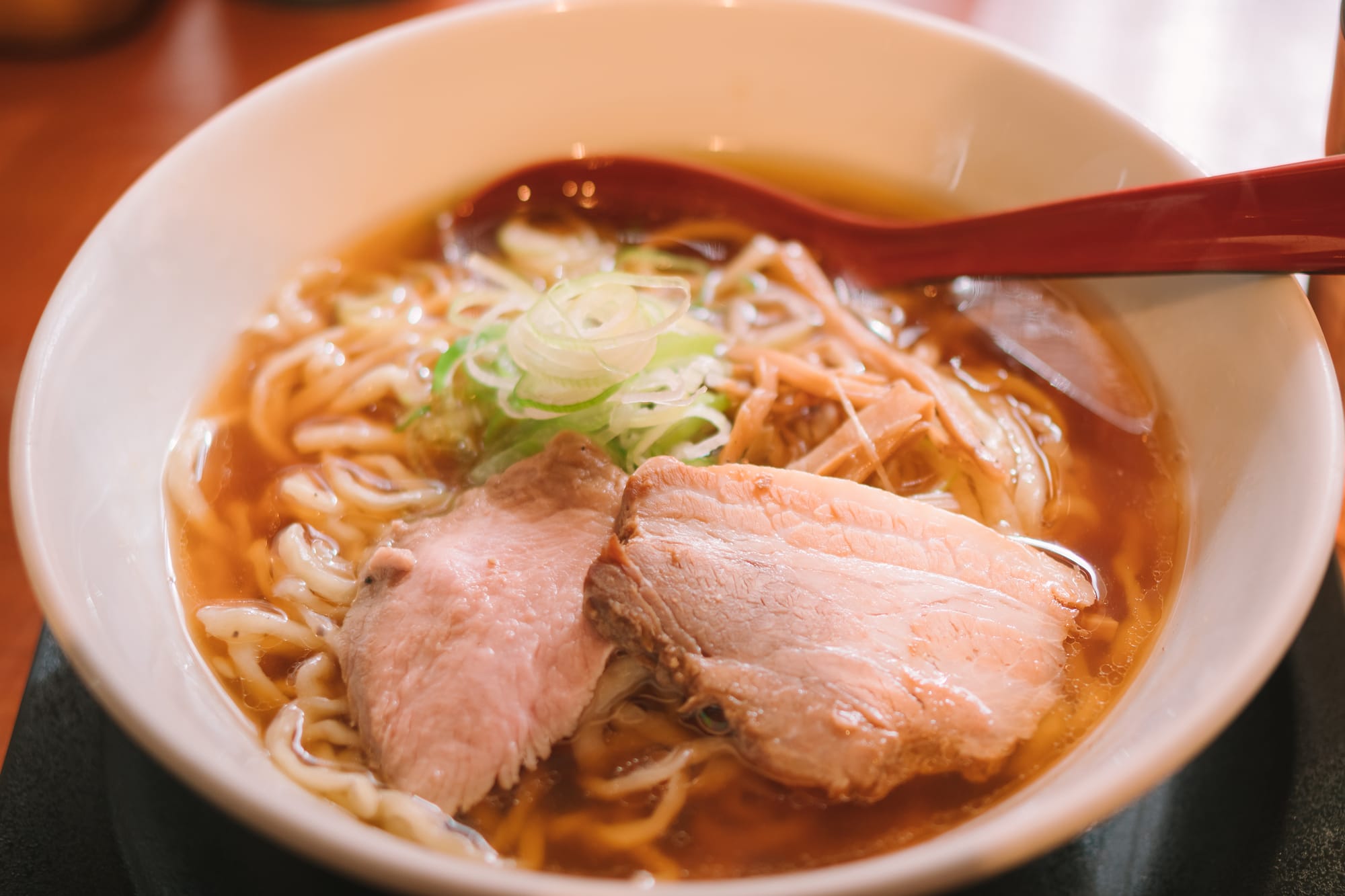 Bowl of Kitakata Chashu Ramen with soy sauce broth, noodles, and sliced pork in Fukushima