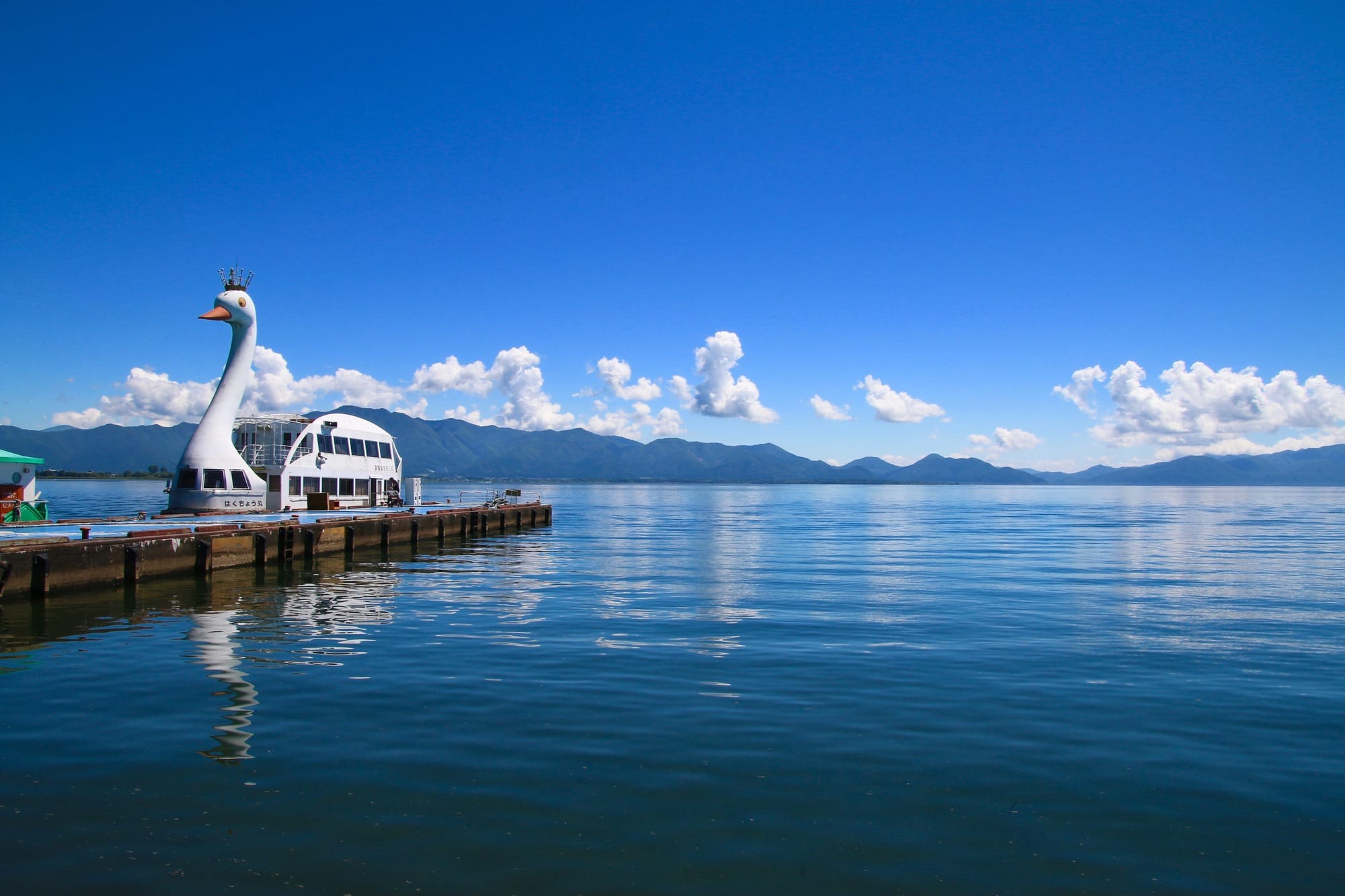 Scenic view of Lake Inawashiro in Fukushima, Japan, with clear water and mountains in the background