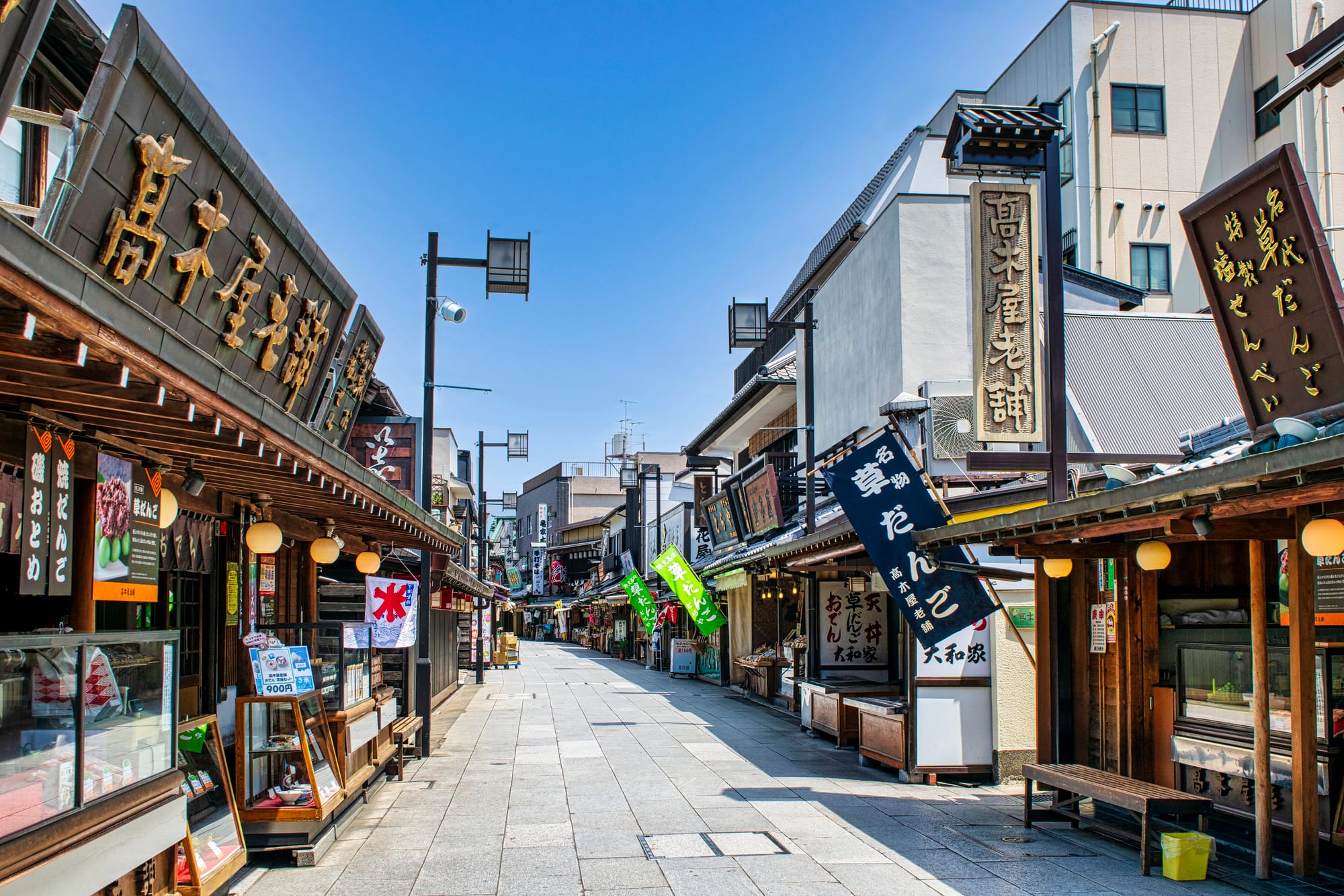 Showa period Shibamata street, filled with food and shopping stalls.