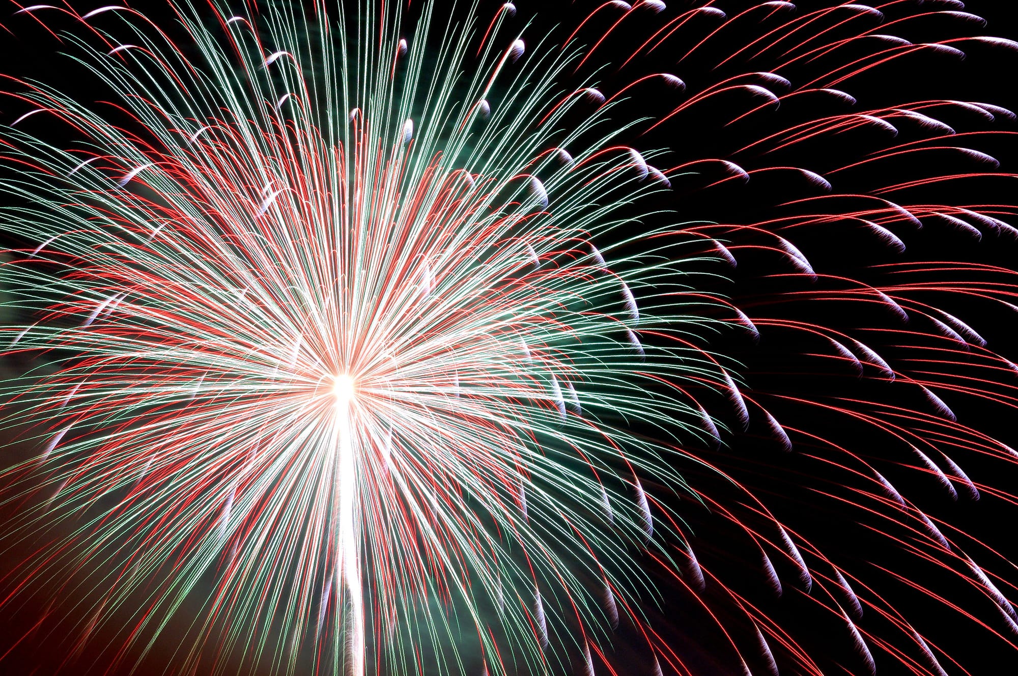 Close-up of fireworks in Tokyo during a summer festival at night