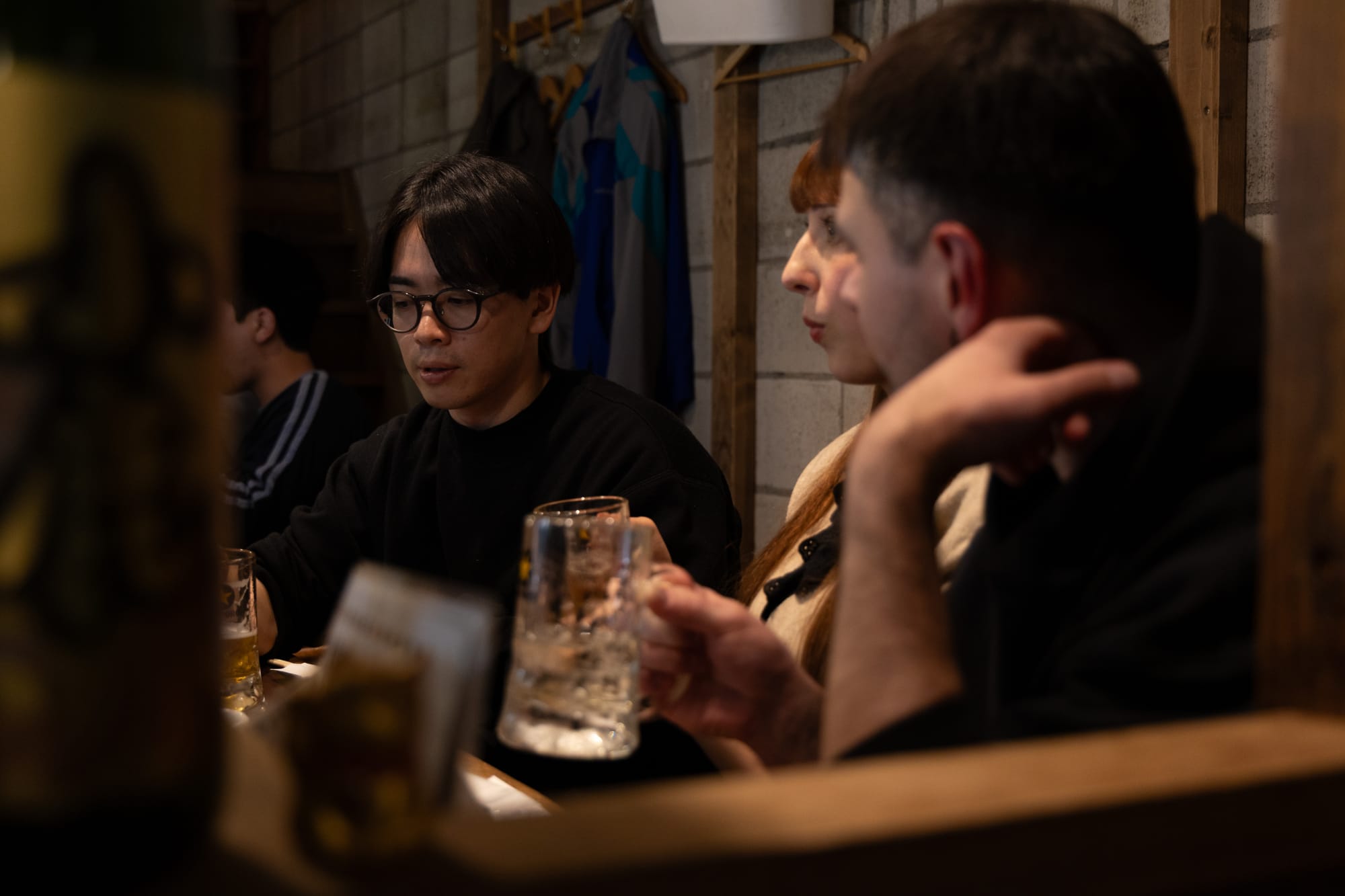 A group having a drink in a small Japanese bar