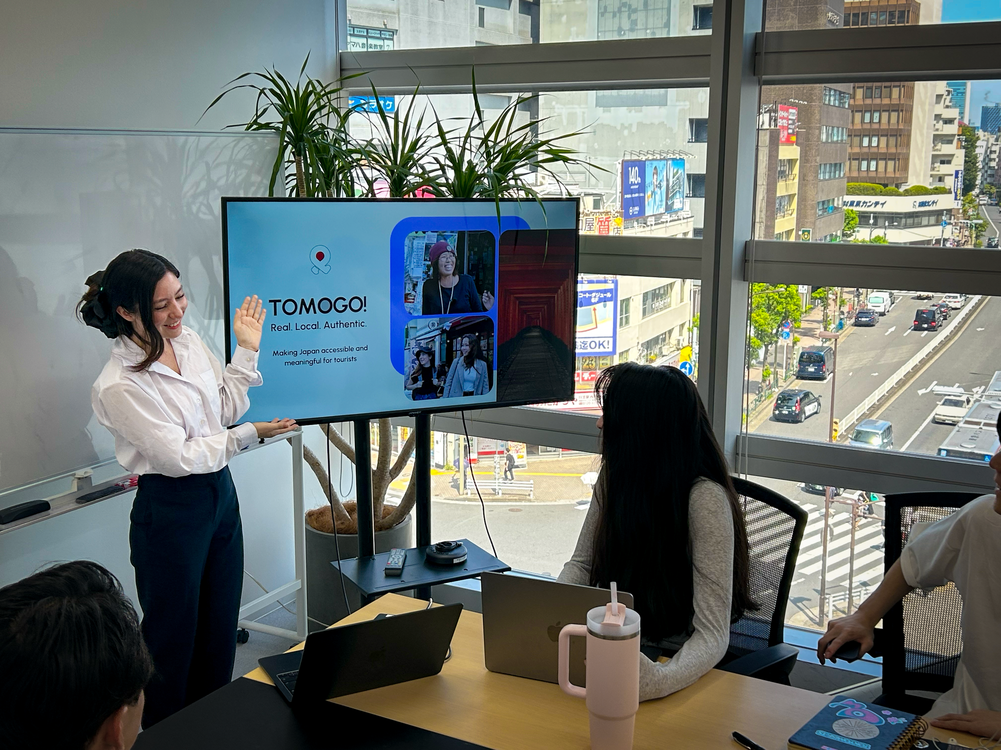 A young woman leads a training seminar for a group of potential tour guides
