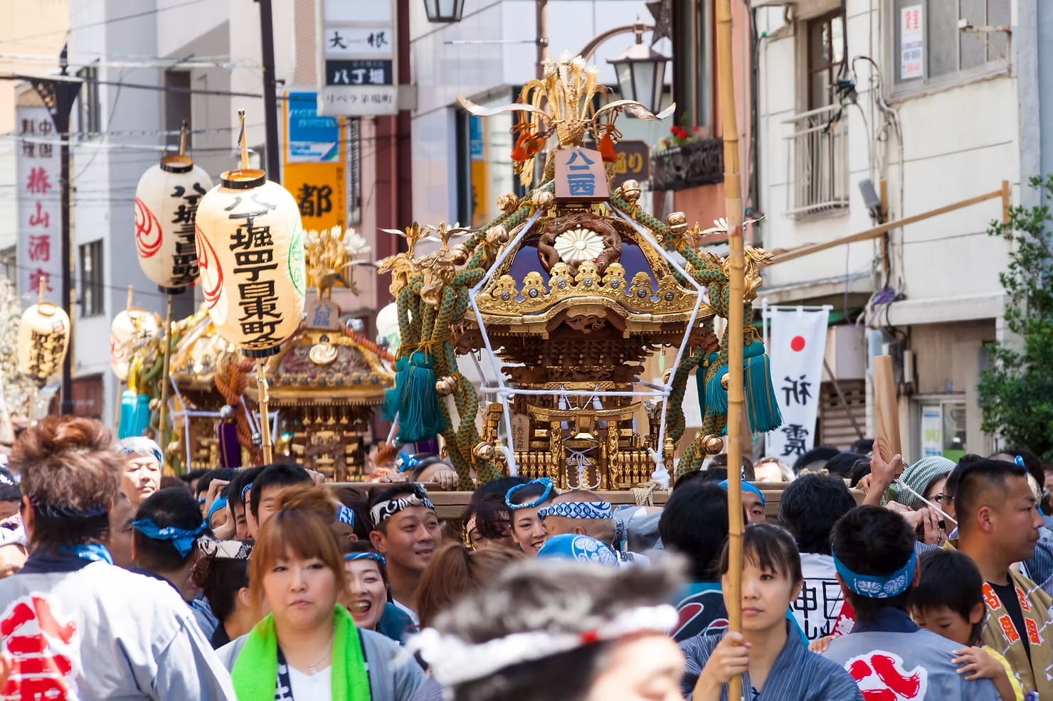 A parade of traditional floats at a summer festival in central Tokyo, Japan