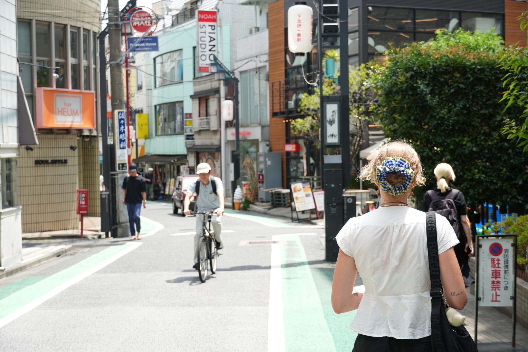 I young girl walking through a side street in Kichijoji