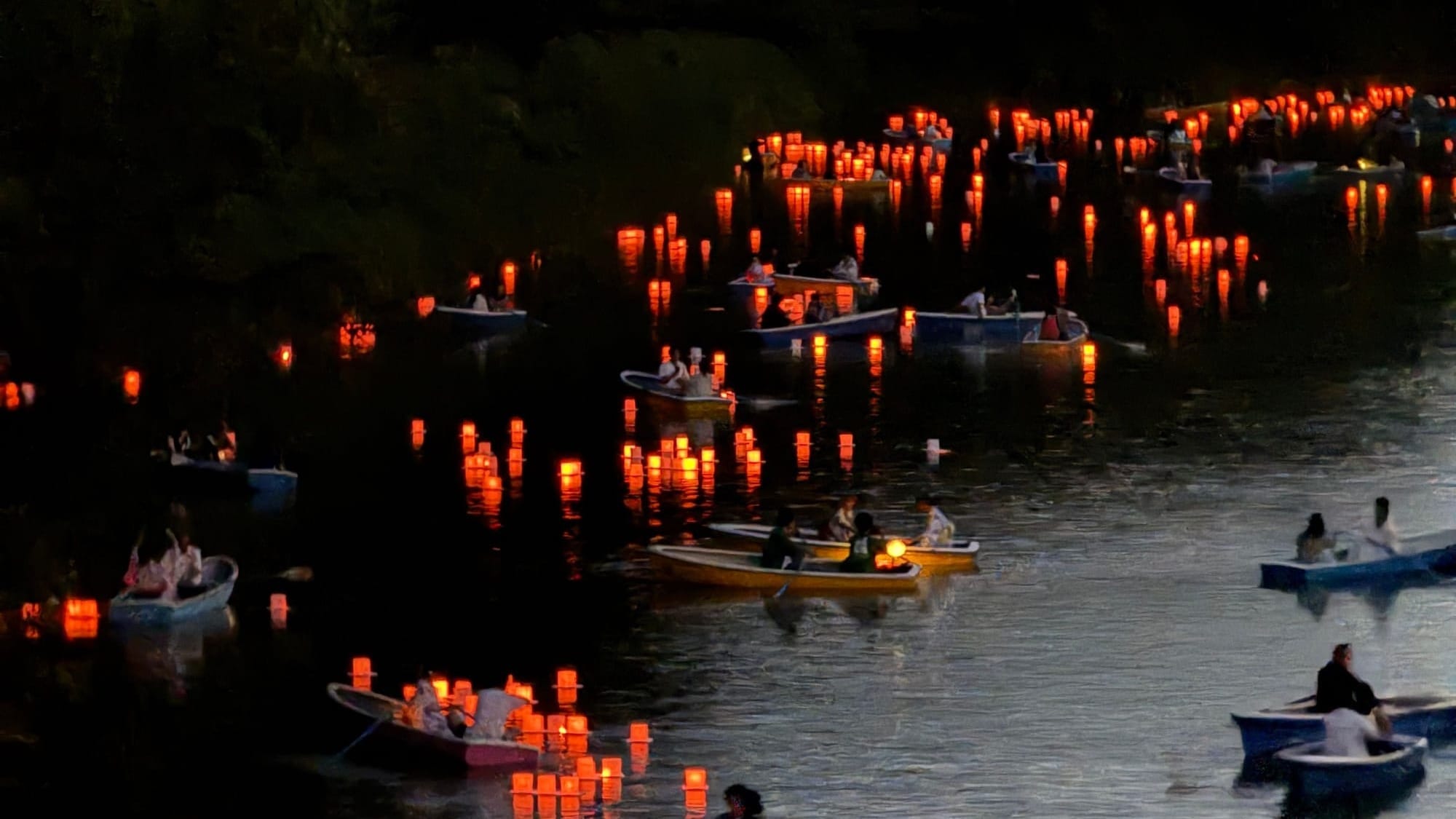 Traditional lanterns float amongst rowing boats on a Tokyo river at sunset, creating a serene summer scene.