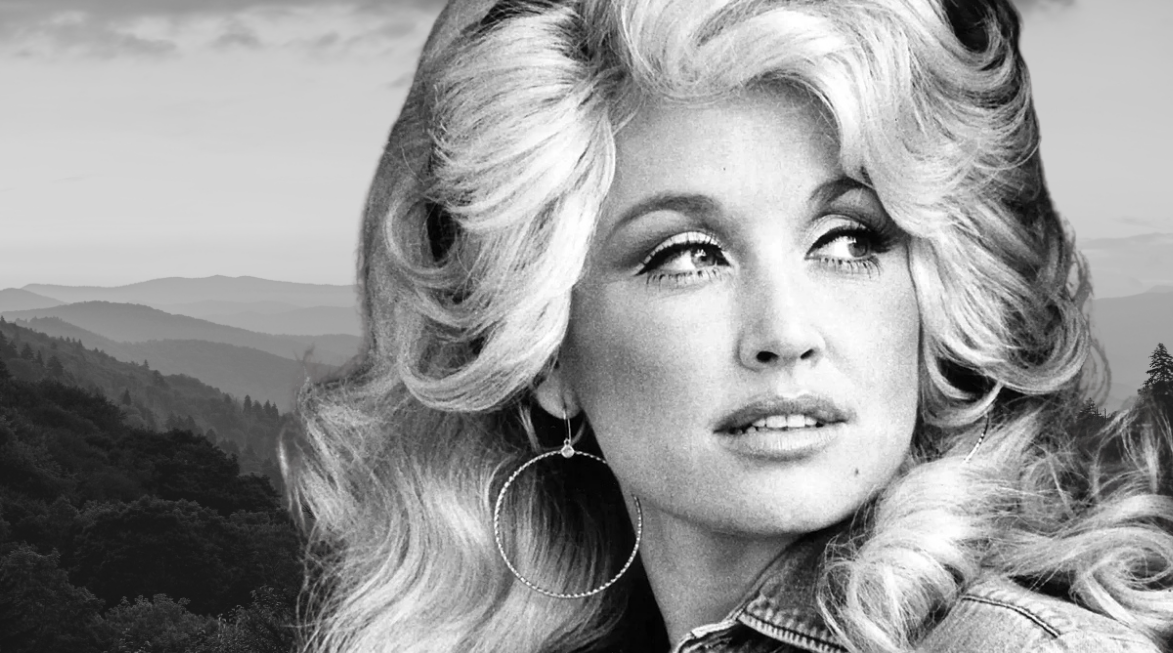 Black and white portrait of Dolly Parton with big hair and hoop earrings, set against the Great Smoky Mountains