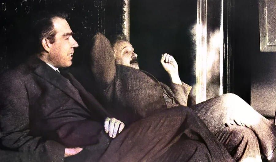 Grainy 1925 photo of Niels Bohr and Albert Einstein, reclining and mid-conversation, at the home of Paul Ehrenfest in Leiden, Germany.