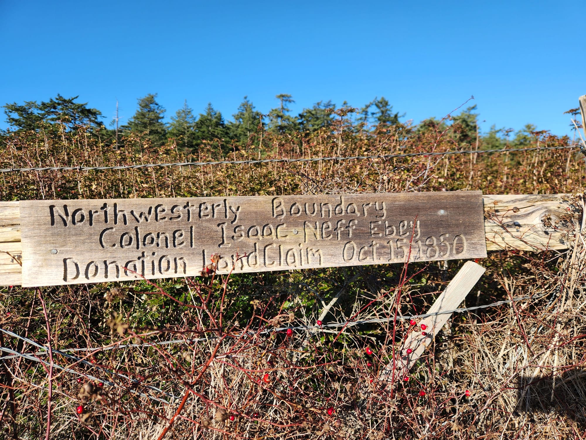 sign reading northwesterly boundary colonel isaac neff ebey donation land claim oct. 15, 1850