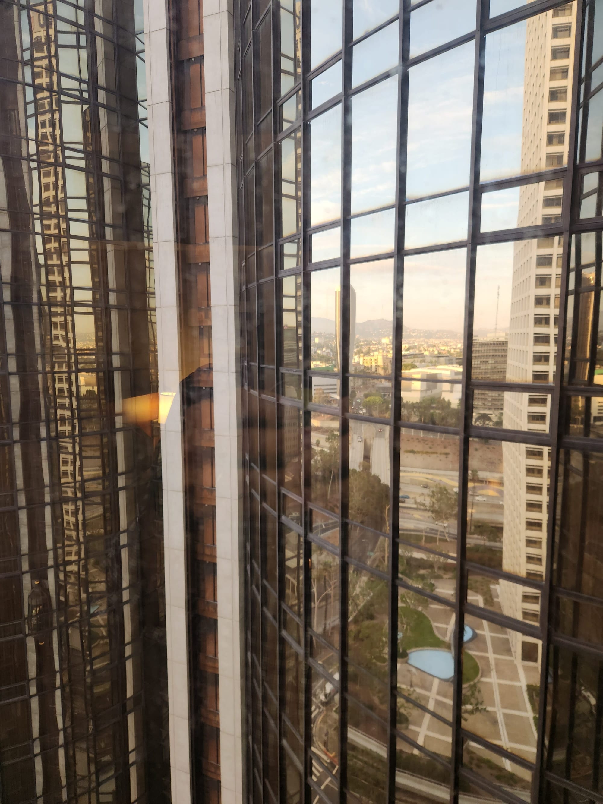 reflections of buildings in windows