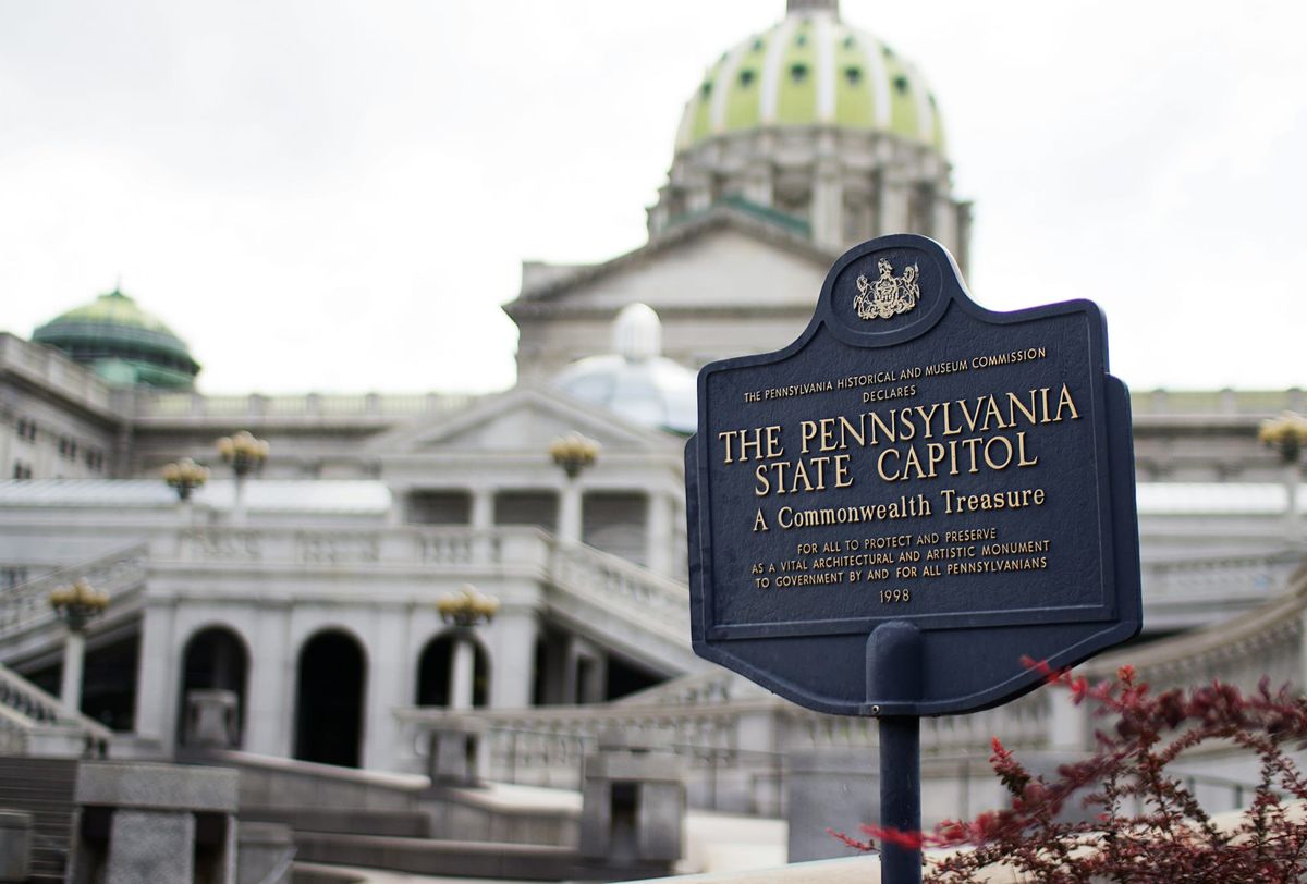 Photo of the Pennsylvania State Capitol with an interpretive sign in the foreground.