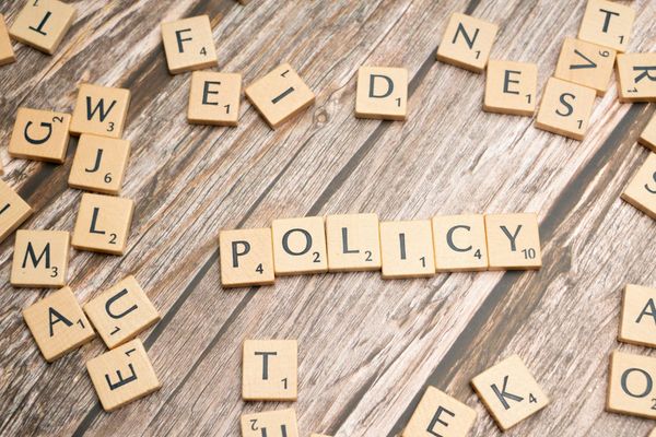 Scrabble letters spelling the word “policy."