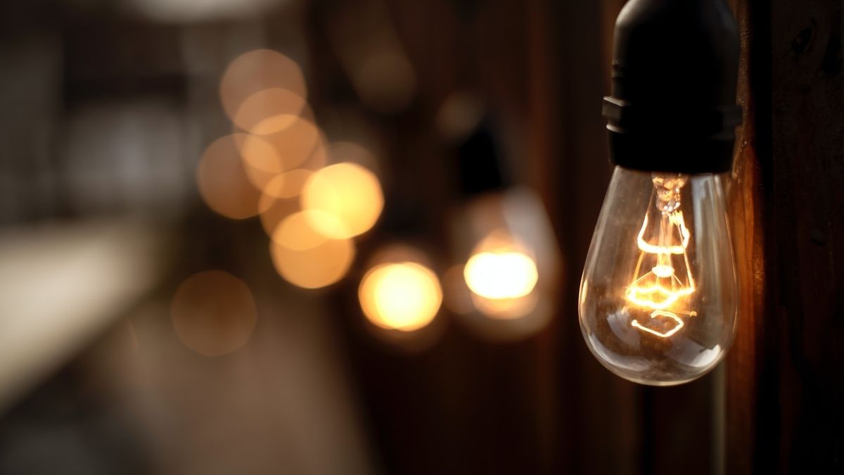 What degrowth is, and why it matters | image of a lightbulb, with other vague lights in the distance