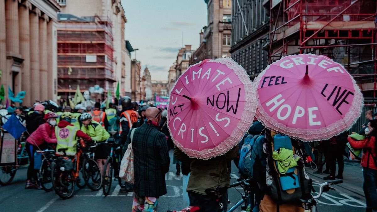 COP27 the change we need and the change we'll get: protestors in Glasglow in 2021 advocating for stronger climate action