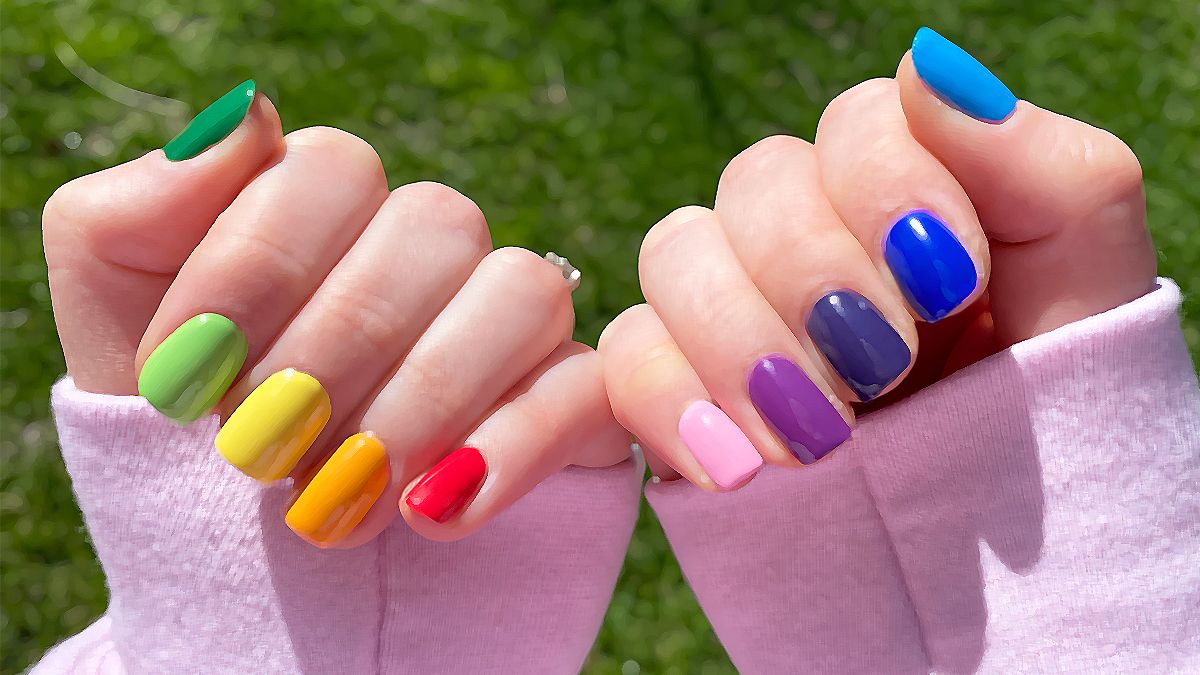 My favorite contradiction: nail polish and femininity, feminism, and men’s liberation | Rebekah's nails in a rainbow skittle