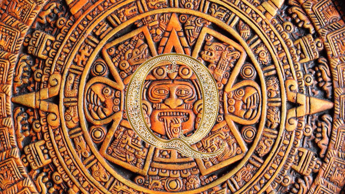 Q in center of Aztec carving