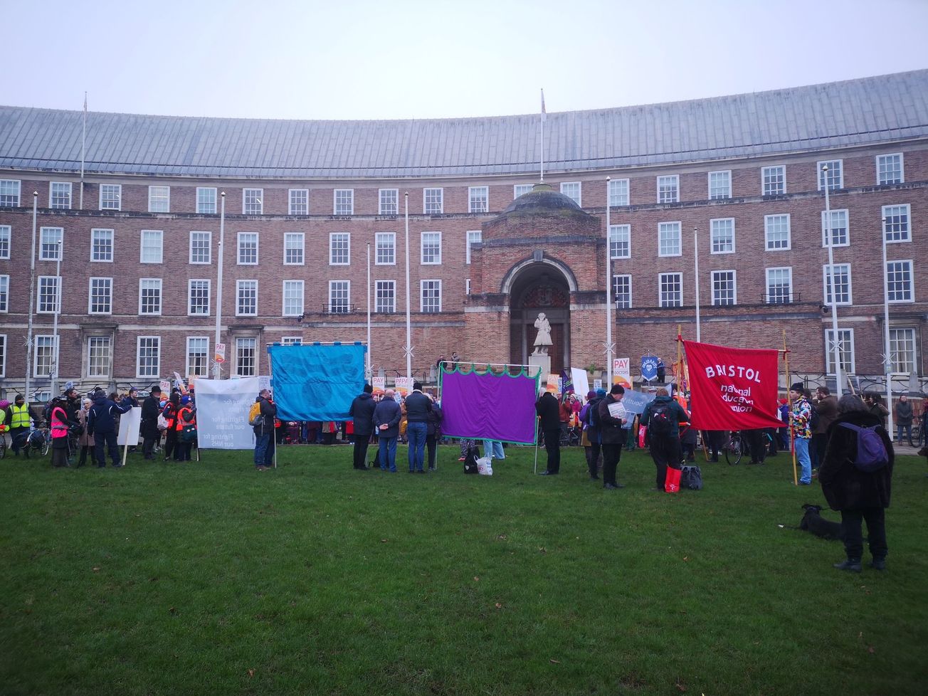 NHS workers march through city for better pay and conditions