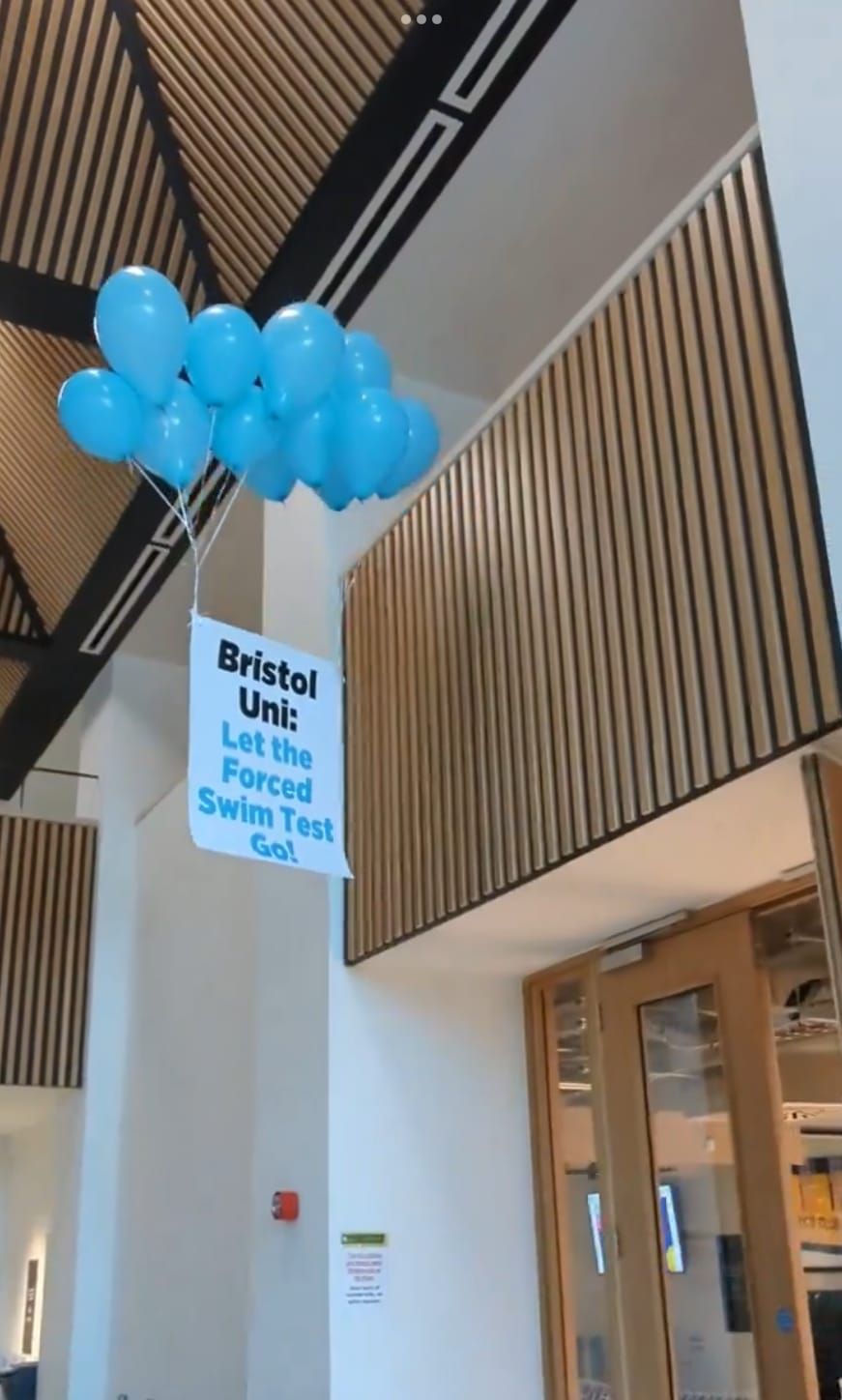 Bristol student protests against Forced Swim Test with a 'floating banner'