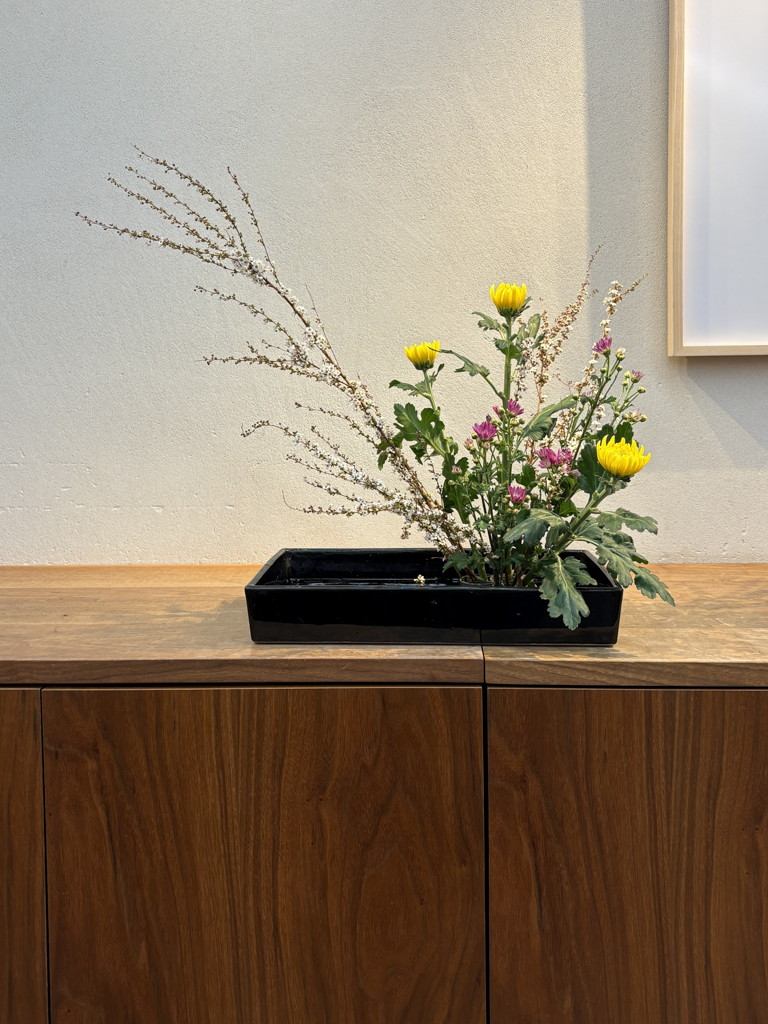 Ikebana emphasizes lines, space, balance, and seasonal awareness