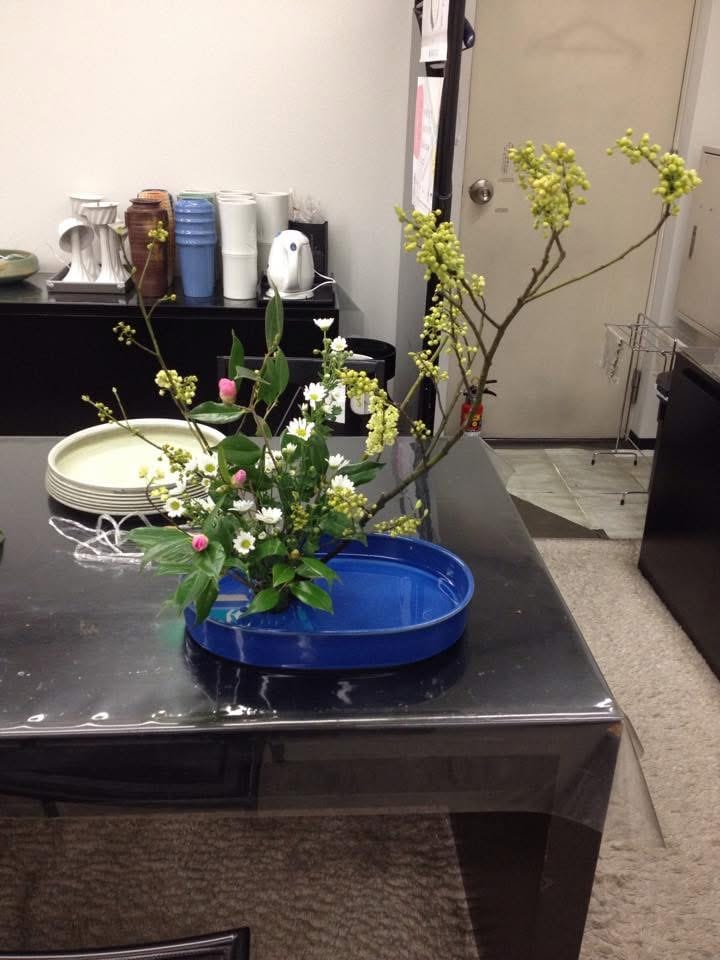 Ikebana arrangement with branches and small flowers from 2012