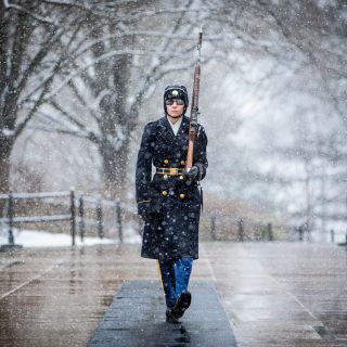 Tomb guard wishes asshole photographer would go away so he could get out of this damn storm